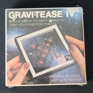GRAVI-TEASE IV Vintage Gravity Hand Game.
